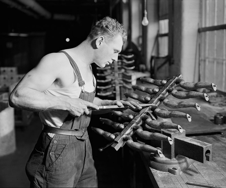 Lewis Hine’s “Setting Eyes on Dolls”, circa 1936. A worker builds rubber doll moulds at a toy factory. The image was part of his project “Men at Work” showing the faces behind the products and infrastructures society regularly took for granted. Photo courtesy of the New York Times